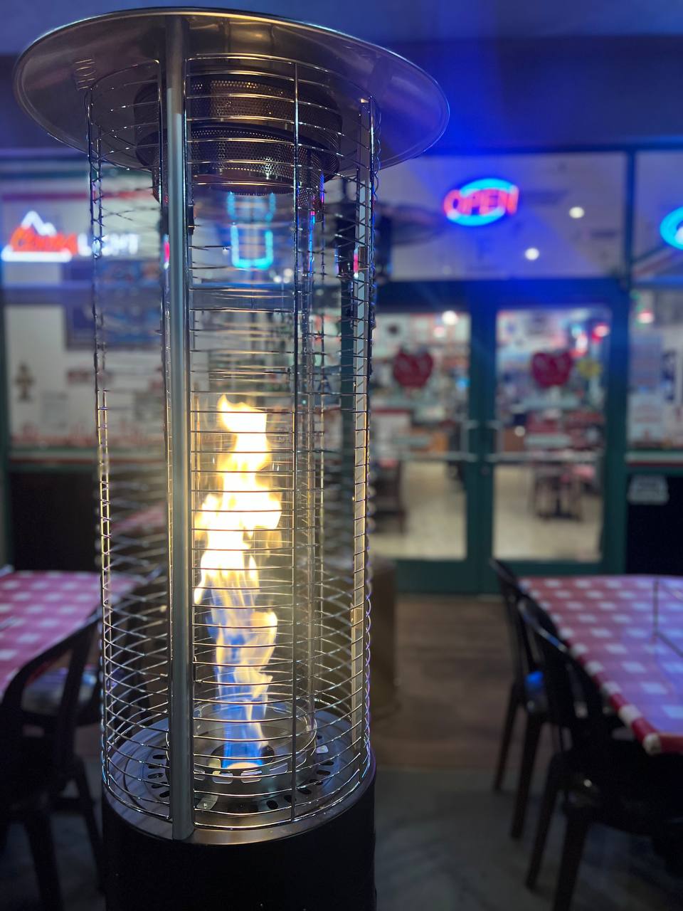 Photo of a outdoor space heater at night